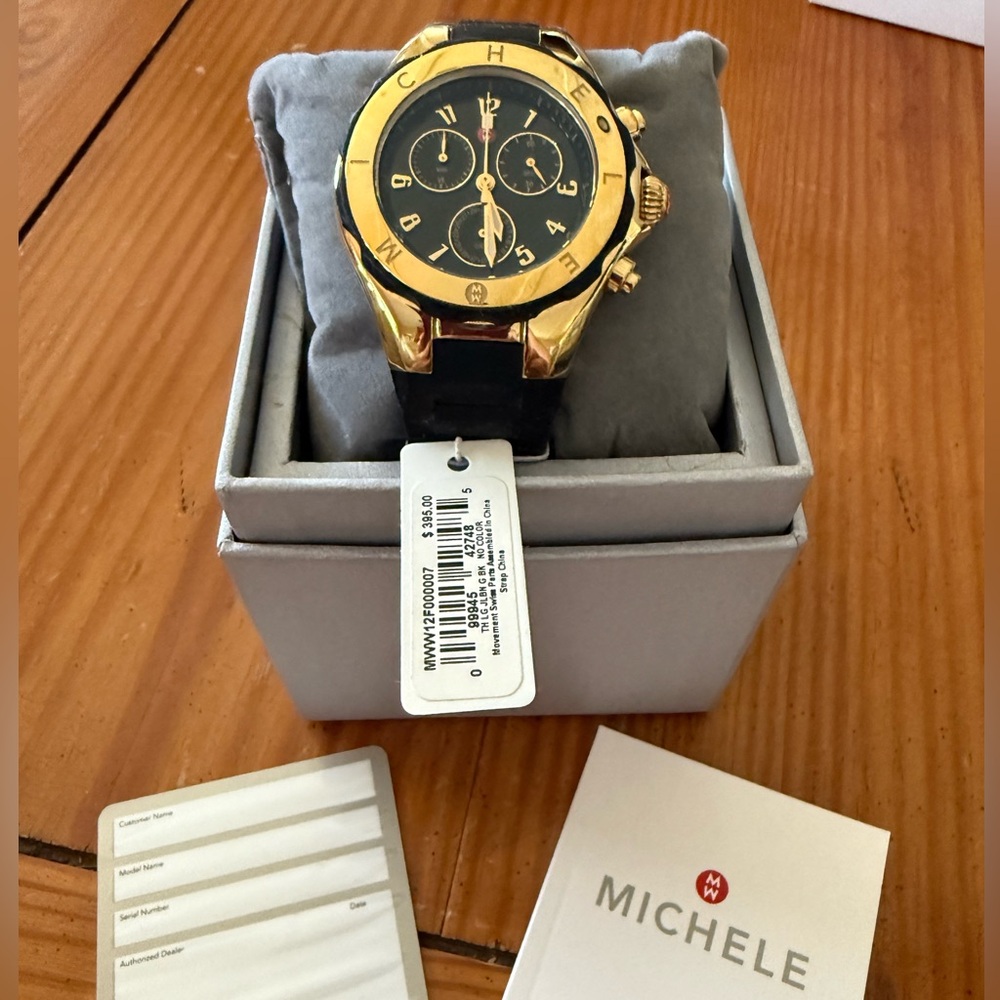 Like new Michele jelly watch in Black and Gold tone w brand new battery.